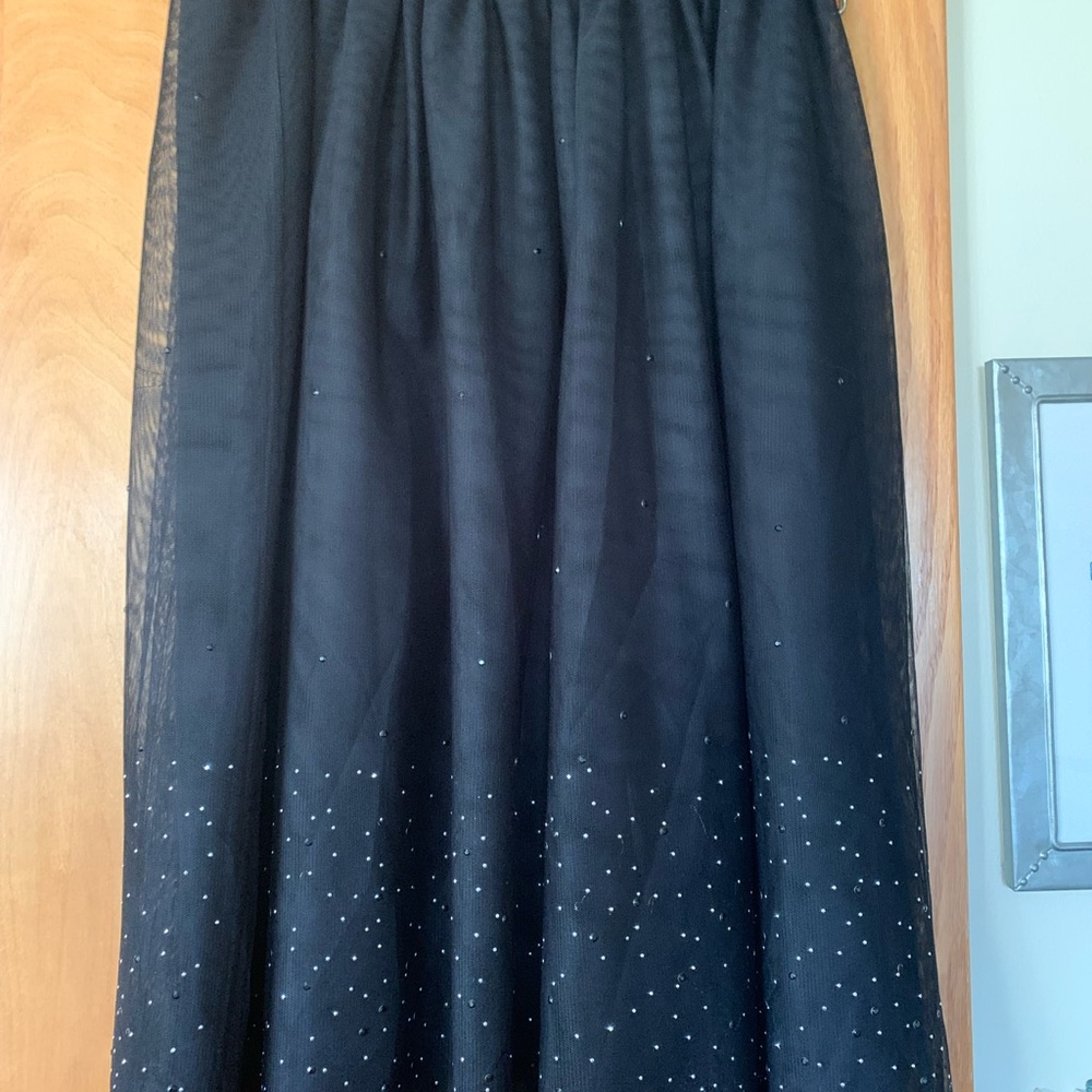 A New Day black skirt with a mesh overlay with a black lining